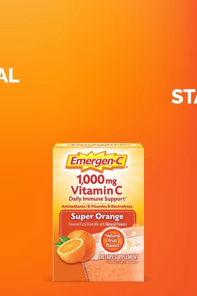 A high-visibility hero shot of a fizzy drink supplement package against a vibrant, monochromatic orange backdrop.